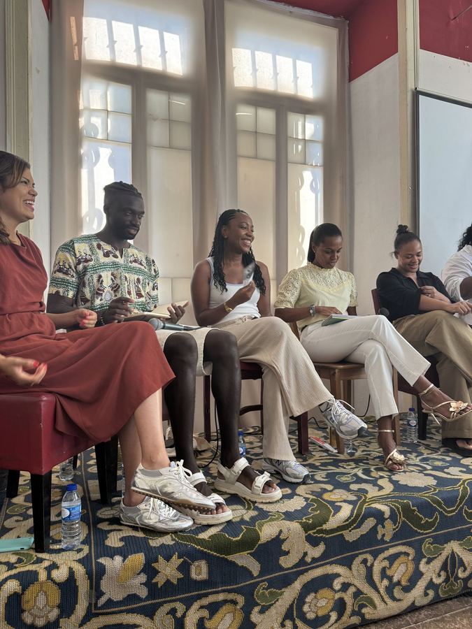 Panel speakers and guests seated together at a BWIT Lisbon talk